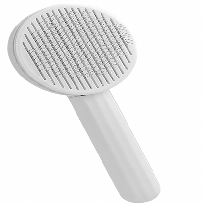 White handheld brush with textured head on a white background